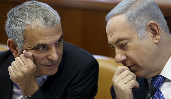 Israeli Prime Minister Netanyahu speaks with Finance Minister Kahlon during the weekly cabinet meeting in Jerusalem